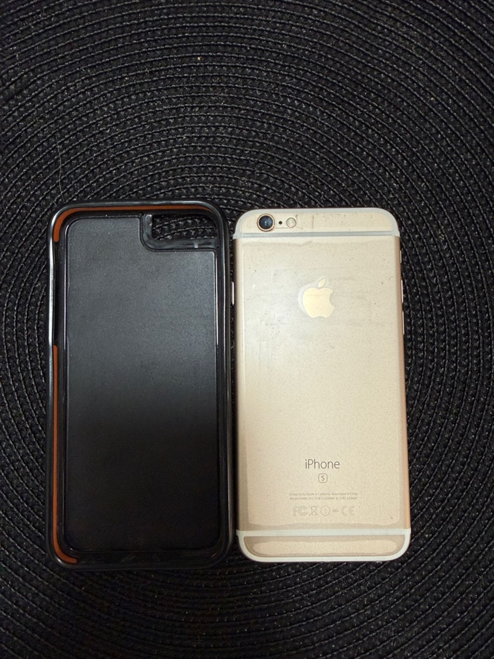 Apple iPhone with Gold Back and Black Protective Case